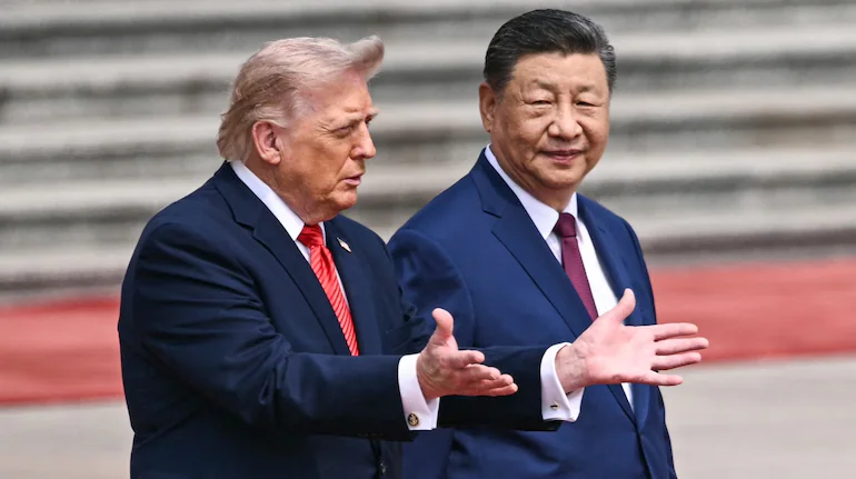 特朗普与习近平2026年5月在北京会面资料图。双方9月峰会谈及三边军控,但未讨论核设施互访|来源:Moneycontrol / Reuters资料图